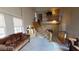 Open concept entryway with curved staircase and view into living room at 3490 S Adobe Ct, Pahrump, NV 89048