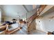 Two story entryway with open staircase and chandelier, leading to living room at 3490 S Adobe Ct, Pahrump, NV 89048