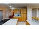 Spacious kitchen featuring ample wood cabinets and an island with a cooktop at 3490 S Adobe Ct, Pahrump, NV 89048