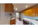 Spacious laundry room with built-in cabinets and a toilet at 3490 S Adobe Ct, Pahrump, NV 89048