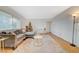Inviting living room with a large sectional sofa, soft carpet, and plenty of natural light at 1420 Vegas Valley Dr # 18, Las Vegas, NV 89169