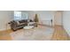 Spacious living room with gray sectional sofa and hardwood floors at 1420 Vegas Valley Dr # 18, Las Vegas, NV 89169