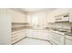 White kitchen with granite countertops and appliances at 4911 Mount Pleasant Ln, Las Vegas, NV 89113