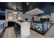 Open-concept bar area with modern stools and sleek design, perfect for entertaining with views at 500 Overlook Rim Dr, Henderson, NV 89012