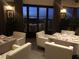Elegant dining area with city views through a picture window; reserved table with seating at 500 Overlook Rim Dr, Henderson, NV 89012