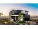 Stunning modern two-story home with black and white accents and professionally landscaped front yard at 500 Overlook Rim Dr, Henderson, NV 89012