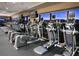 State-of-the-art gym with cardio machines, TVs, and panoramic city views through expansive windows at 500 Overlook Rim Dr, Henderson, NV 89012