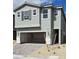 Charming two-story home with a two-car garage and neutral-toned exterior paint at 7116 Parkallen Ave, Las Vegas, NV 89113
