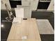 Sample board of kitchen finishes, including white cabinets and stainless steel appliances at 7116 Parkallen Ave, Las Vegas, NV 89113