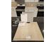 Sample board of kitchen finishes, with gray cabinets and stainless steel appliances at 7116 Parkallen Ave, Las Vegas, NV 89113