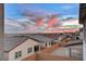 Aerial view of houses with a beautiful sunset in the background at 9002 Shifting Skye St, Las Vegas, NV 89166