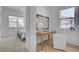 Cozy bedroom featuring a bed, desk, chair, and large windows providing natural light at 9002 Shifting Skye St, Las Vegas, NV 89166