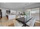 Spacious dining area flows into an open kitchen and living space, perfect for entertaining at 9002 Shifting Skye St, Las Vegas, NV 89166