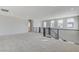 Spacious loft area with multiple windows and a modern railing at 9002 Shifting Skye St, Las Vegas, NV 89166