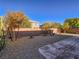 Landscaped backyard with gravel and a patio area at 10260 Danskin Dr, Las Vegas, NV 89166