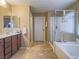 Double vanity bathroom with soaking tub and shower at 10260 Danskin Dr, Las Vegas, NV 89166