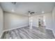 Spacious bedroom with ceiling fan and gray flooring at 1761 Moose St, Pahrump, NV 89048