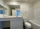Bathroom with a double vanity, a large mirror and a tub with shower at 2723 Luzzi Walk, Henderson, NV 89044