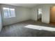 Cozy bedroom with natural light and plush gray carpeting at 2723 Luzzi Walk, Henderson, NV 89044