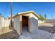 Small storage shed in backyard with open door at 4880 Welter Ave, Las Vegas, NV 89104