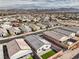 Overhead view presenting a modern home with solar panels, backyard, and surrounding desert landscape at 617 Sylvan St, Henderson, NV 89002