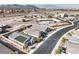 Wide aerial shot displaying desert community, nearby highway, and a home with solar panels at 617 Sylvan St, Henderson, NV 89002