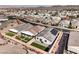 Extensive aerial perspective highlighting a modern home with green backyard and surrounding desert community at 617 Sylvan St, Henderson, NV 89002