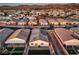 Serene aerial perspective showcasing a home with solar panels, artificial grass, and a neighborhood view at 617 Sylvan St, Henderson, NV 89002