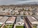 Sweeping aerial view exhibiting a modern home's backyard, landscaping, and the expansive desert community at 617 Sylvan St, Henderson, NV 89002