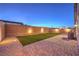 Backyard featuring artificial grass, pavers, and gravel at 617 Sylvan St, Henderson, NV 89002