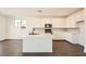 Bright kitchen featuring white cabinets, stainless steel appliances, and a center island at 9881 Lost Horse Ave, Las Vegas, NV 89178