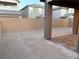 Large backyard with covered patio and block wall at 5076 Dule Grove St, Las Vegas, NV 89130