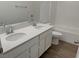 Bathroom boasts a double vanity and tile flooring at 5076 Dule Grove St, Las Vegas, NV 89130