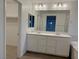Double vanity bathroom with soaking tub and walk-in shower at 5076 Dule Grove St, Las Vegas, NV 89130