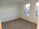 Well-lit bedroom with neutral carpeting and large window at 5076 Dule Grove St, Las Vegas, NV 89130