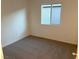 Spacious bedroom with neutral carpet and large window at 5076 Dule Grove St, Las Vegas, NV 89130