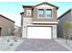 Two-story house with stone accents and a two-car garage at 5076 Dule Grove St, Las Vegas, NV 89130