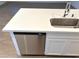 Kitchen island with quartz countertop and stainless steel dishwasher at 5076 Dule Grove St, Las Vegas, NV 89130