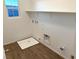 Laundry room with tile floor, shelving and drain at 5076 Dule Grove St, Las Vegas, NV 89130