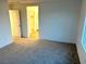 Main bedroom with carpet flooring and ensuite bathroom at 5076 Dule Grove St, Las Vegas, NV 89130