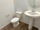 Small powder room with pedestal sink and tile floor at 5076 Dule Grove St, Las Vegas, NV 89130