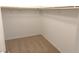 Spacious walk-in closet with wood closet rods at 5076 Dule Grove St, Las Vegas, NV 89130