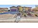 Single-story house with a large driveway and desert landscaping at 7143 Nodding Thistle Ct, Las Vegas, NV 89178