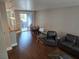 Living area with hardwood floors and dining table at 9050 W Tropicana Ave # 1135, Las Vegas, NV 89147