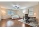Bedroom features a ceiling fan, windows and an office setup at 3605 Sapphire Sea Ct, North Las Vegas, NV 89031