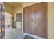 Inviting front entrance with a sturdy, paneled front door and stone pillar accents at 3605 Sapphire Sea Ct, North Las Vegas, NV 89031