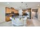 Kitchen with a granite island, modern lighting, and stainless steel appliances at 3605 Sapphire Sea Ct, North Las Vegas, NV 89031