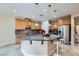 Well-equipped kitchen boasts a granite island and stainless steel appliances at 3605 Sapphire Sea Ct, North Las Vegas, NV 89031