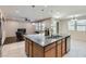 Kitchen featuring a large island with seating, open to the living area at 3605 Sapphire Sea Ct, North Las Vegas, NV 89031