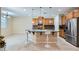 Open kitchen features a large island with seating and stainless steel appliances at 3605 Sapphire Sea Ct, North Las Vegas, NV 89031